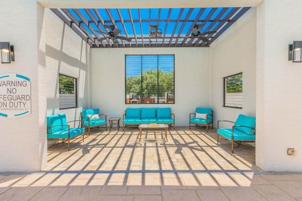 Outdoor seating space with pergola shade at The Spring at Silverton in Fort Worth, Texas.