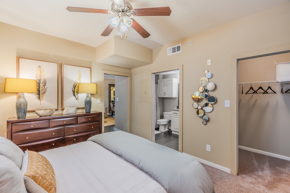 Master bedroom with a en-suite bathroom and large walk-in closet at The Spring at Silverton in Fort Worth, Texas.