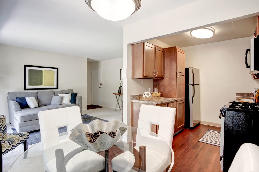 A furnished living room and kitchen at Park Naylor Apartments in Washington, District of Columbia