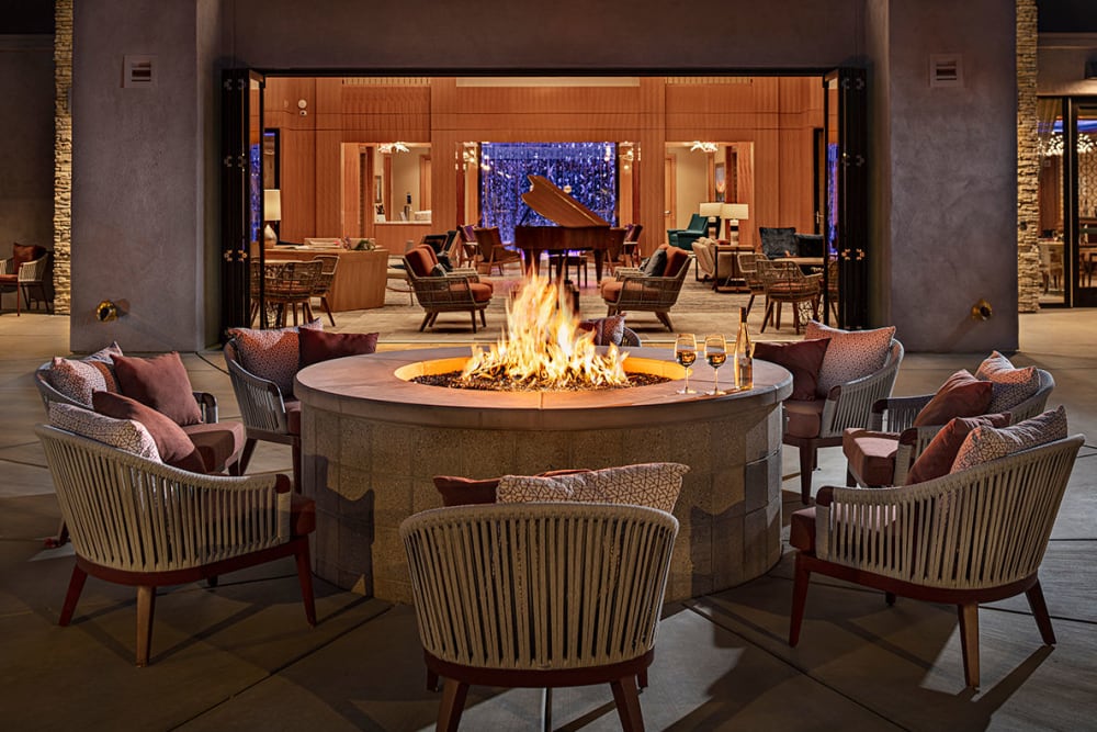 Chairs arranged around a fire pit at All Seasons Oro Valley in Oro Valley, Arizona