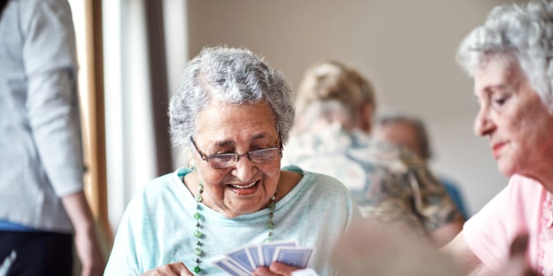 Residents playing cards at The Blake at Panama City Beach in Panama City Beach, Florida