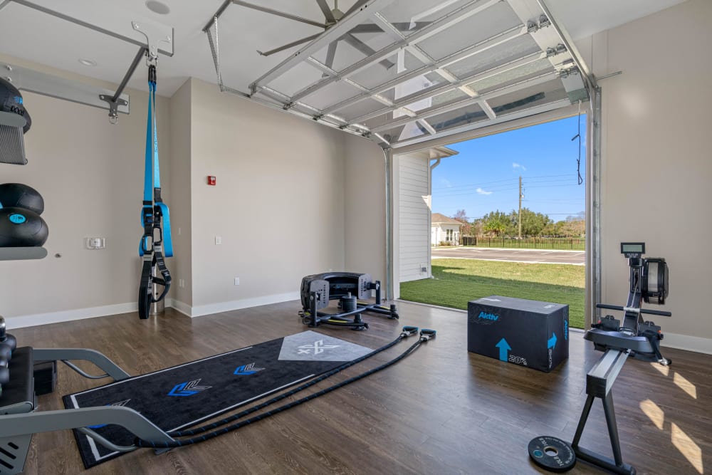 Fitness equipment in the resident gym at The Griffon Vero Beach | Apartments in Vero Beach, Florida