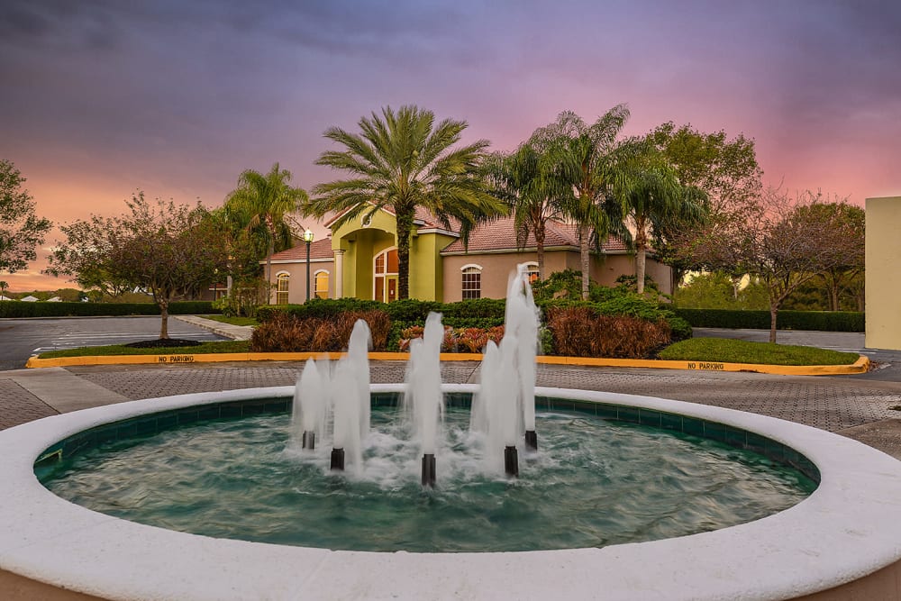 Fountain at sunset at Royal St. George at the Villages Apartment Homes in West Palm Beach, Florida