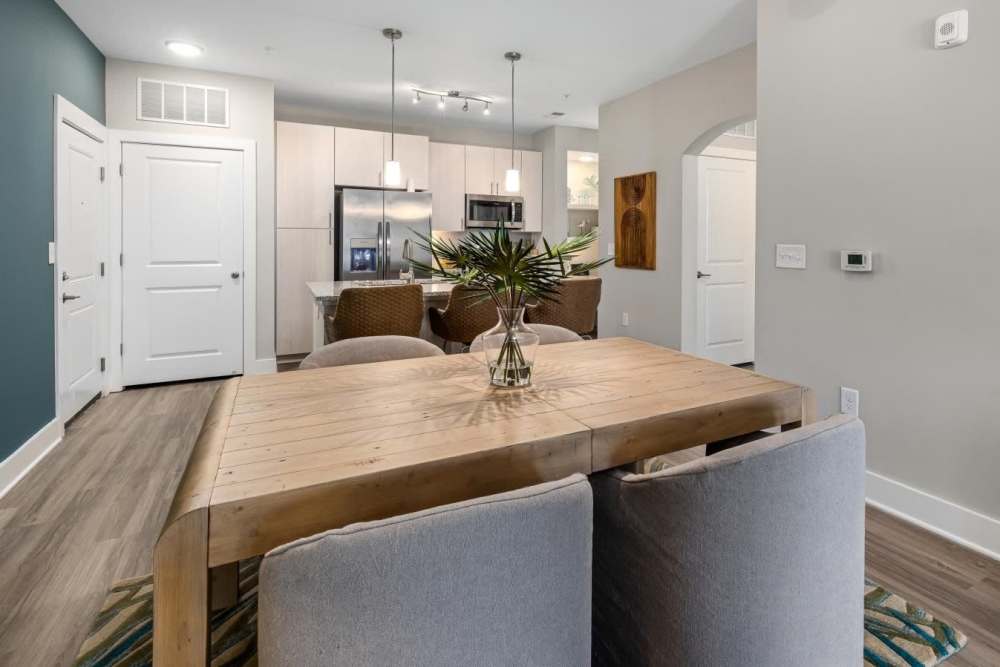 Kitchen table in dining room with an open layout that connects to kitchen at  Hudson Carolina Forest in Myrtle Beach, South Carolina