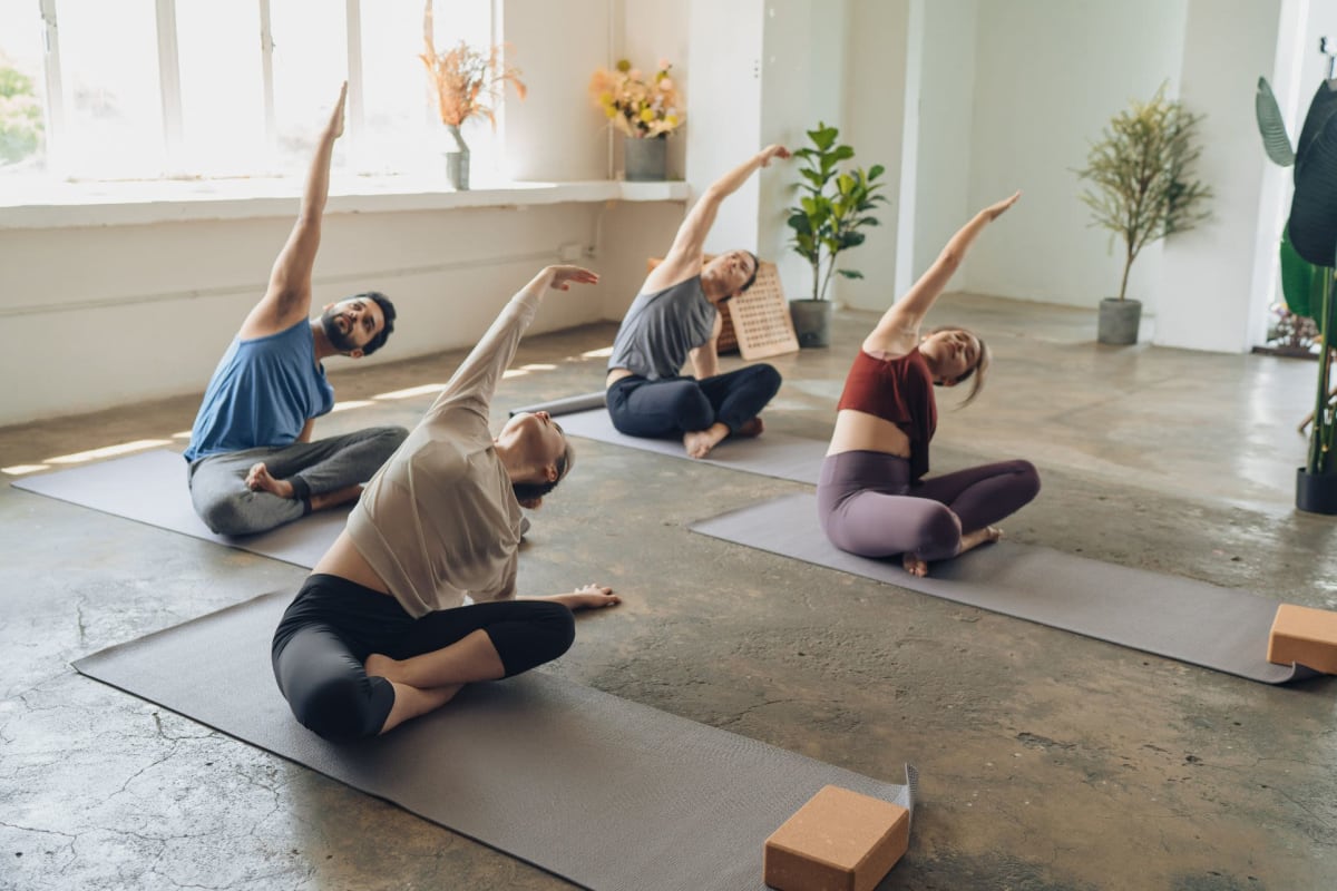 Residents practice yoga in the fitness center at Willow Creek, San Jose, California