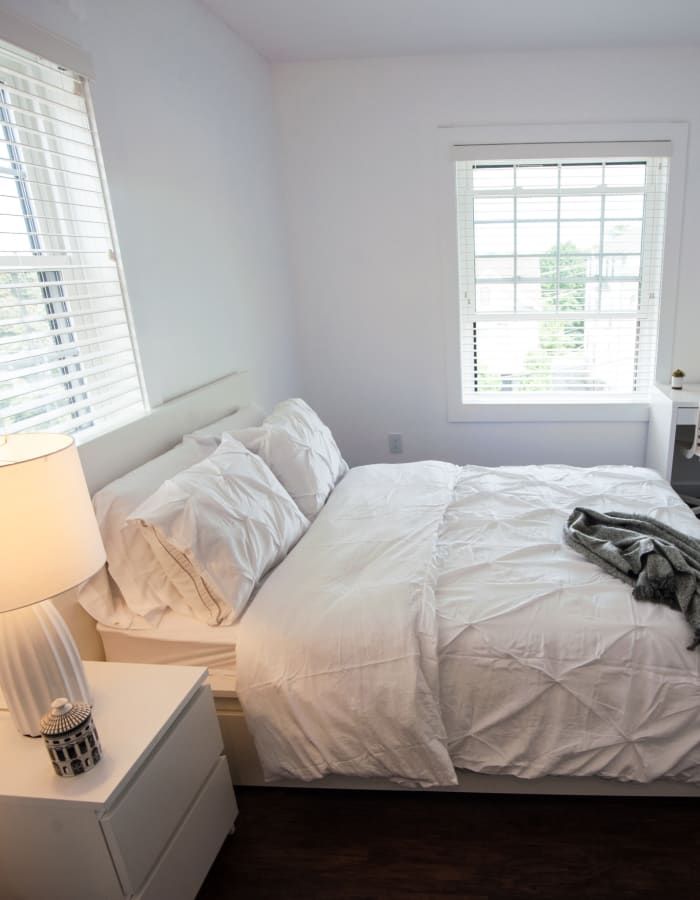 Simple white bedroom at Campus Prime in Syracuse, New York