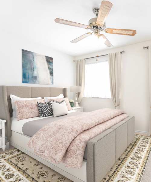 Bedroom with carpet flooring and large widnow at Oaks On Bonhomme in University City, Missouri