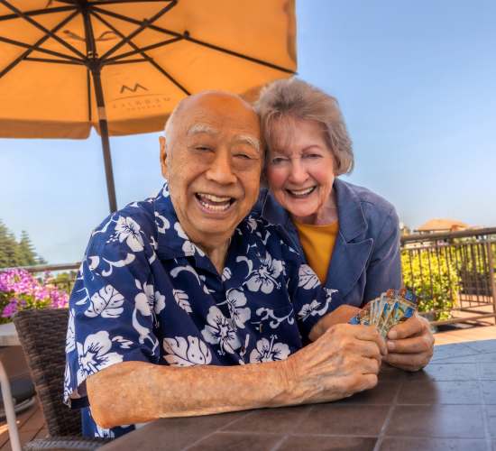 Resident couple poses for a picture at Merrill Gardens at Gilroy in Gilroy, California. 
