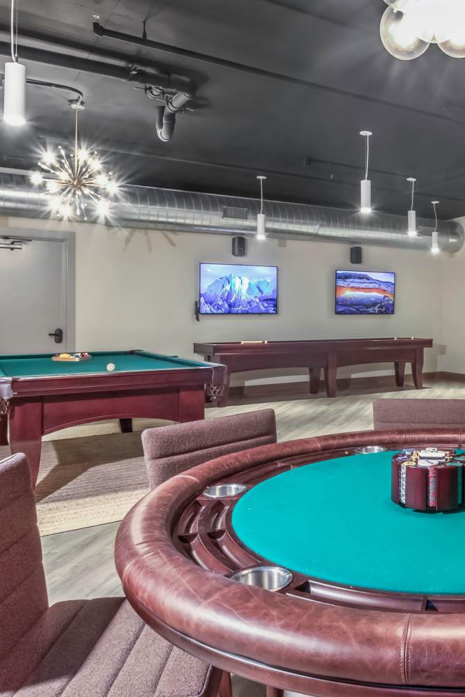 Game lounge with poker foosball, billiards and shuffleboard at Greenside in Charlotte, North Carolina