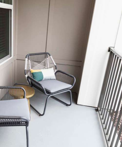 Patio with two chairs at The Waterfront on Hatchett Creek in Venice, Florida