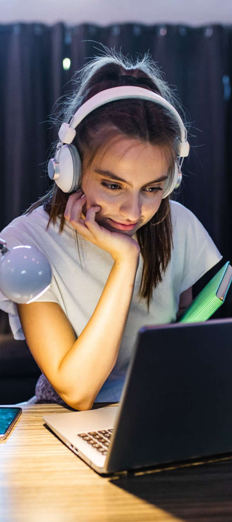 Student focusing on her laptop at Midtown 905 in Denton, Texas
