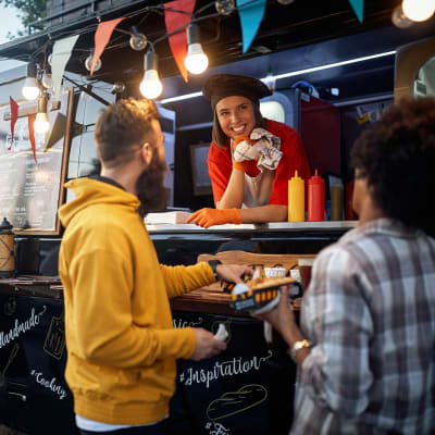 People ordering from a food cart near 2370 Main at Sugarloaf in Duluth, Georgia