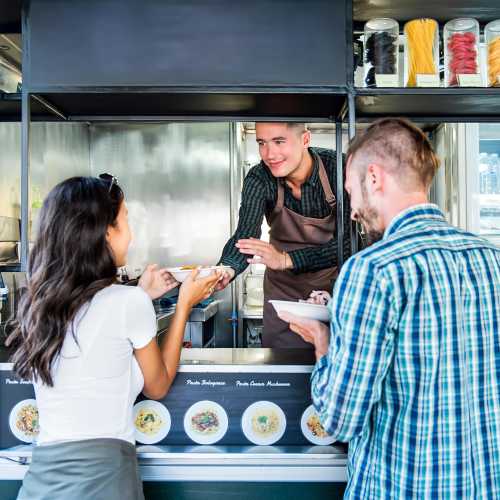 Residents having food at a food truck near Stonecrest Apartments in Spokane, Washington