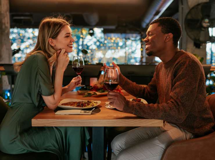 Resident couple enjoying food in a restaurant near Walden Creek in Greenville, South Carolina