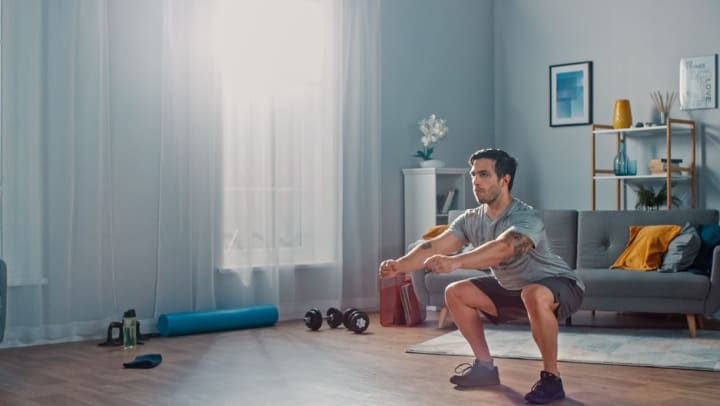 Resident getting in a home workout at Olympus Auburn Lakes in Spring, Texas