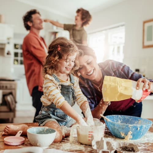 A family in a kitchen at Dahlgren Townhomes in Dahlgren, Virginia