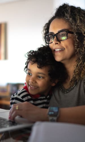 Resident working from home with some help from her son at Willow Glen in Fort Worth, Texas