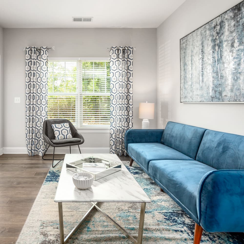 Wood flooring in an apartment dining room and living room at Retreat at the Park in Burlington, North Carolina