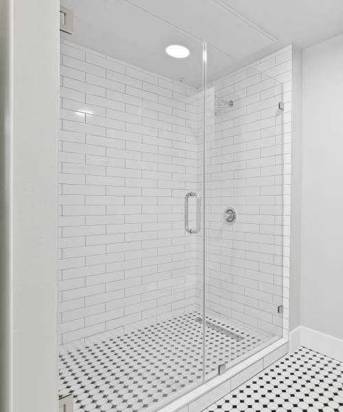 Bathroom with glass shower at Archer Medical District in Dallas, Texas