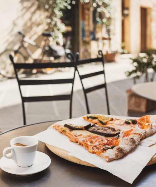 Fresh big slices of pizza on a table at an outdoor restaurant near Fox Run Crossing in Piketon, Ohio
