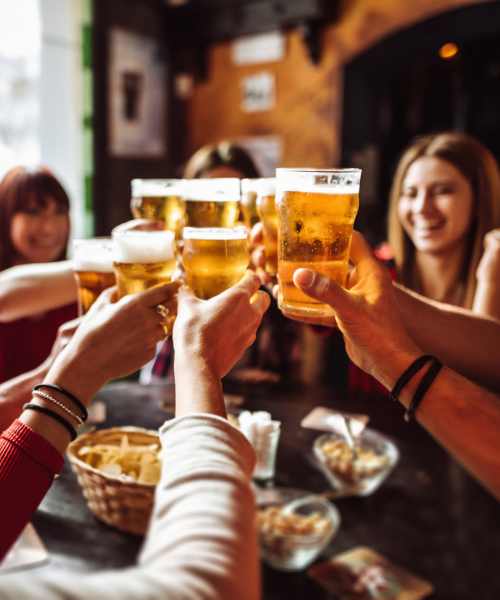 Resident friends gathering for beers at a bar near The Standard at Pinestone in Travelers Rest, South Carolina