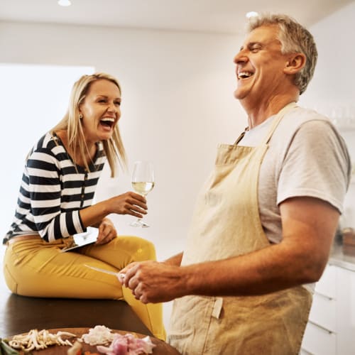 A happy couple in kitchen at Paradise Gardens in San Diego, California