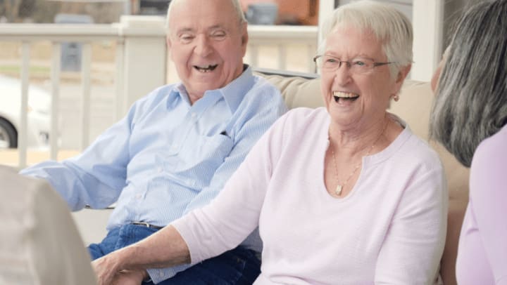 Senior couple laughing at home 