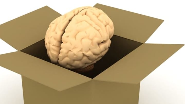 Illustration, human brain inside of a cardboard packing box.