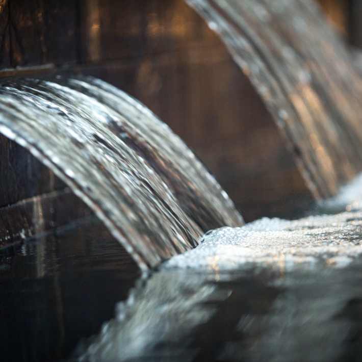 Water feature near pool at Attain Downtown, Norfolk, Virginia