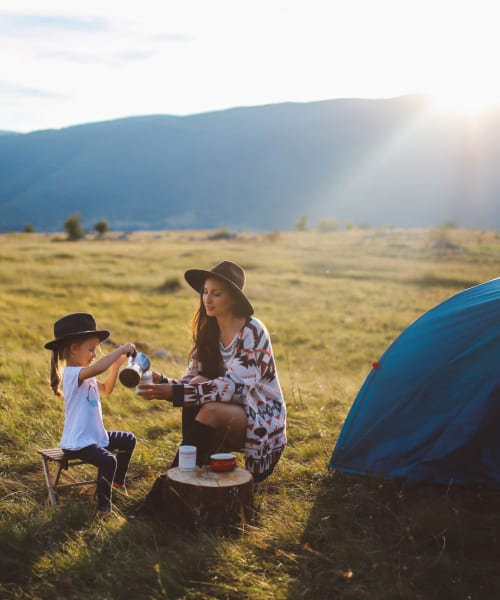 Resident mother and daughter camping near Landmark Apartments Phase II in Little Rock, Arkansas