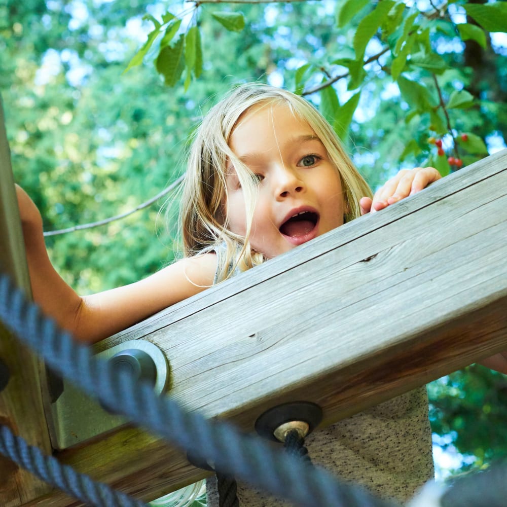 A kid playing at playground near Discovery at Craig Ranch in McKinney, Texas