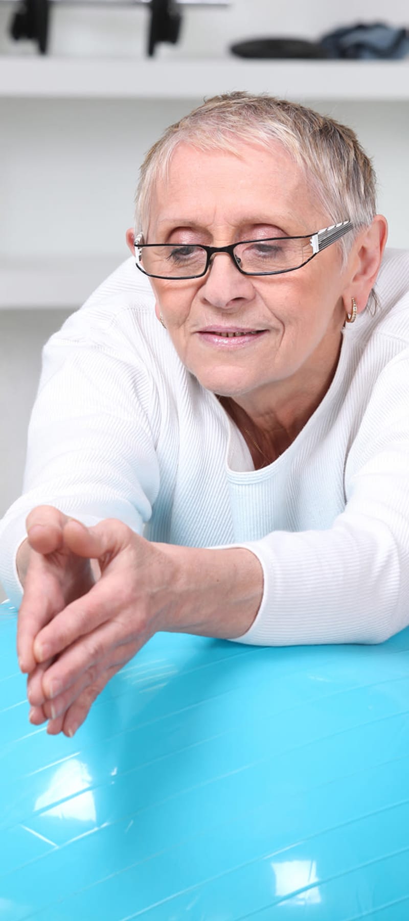 Resident rolling on an exercise ball at Ingleside Communities in Mount Horeb, Wisconsin