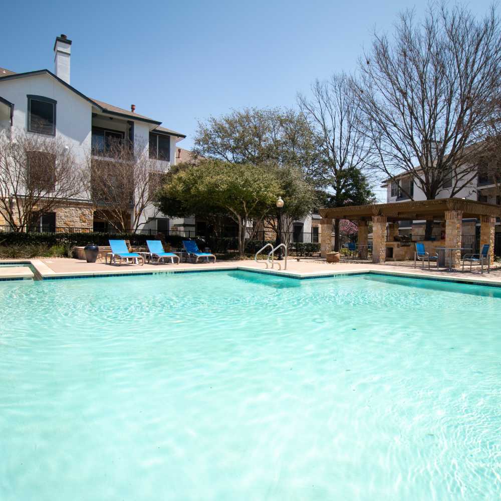 Resort-style pool with lounge chairs at Sutton in Austin, Texas