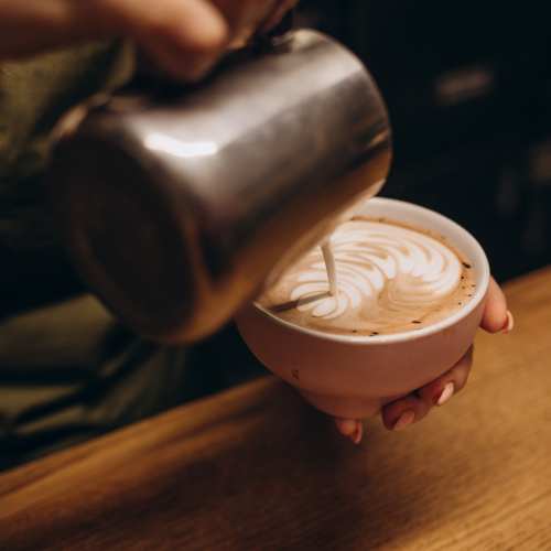 Barista pouring coffee near Cottage Street at eTown in Jacksonville, Florida
