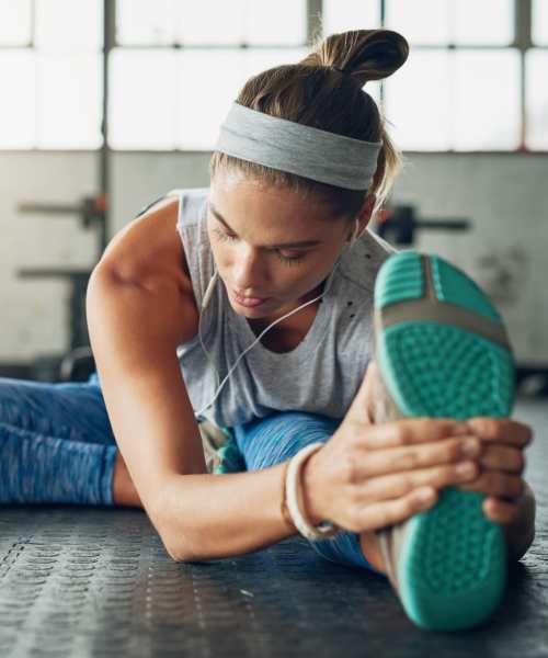 Woman working out in the gym at 1729 Midtown in Lexington, Kentucky