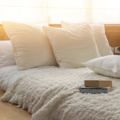 A well-lit bedroom in a home at Joshua Heights in Twentynine Palms, California