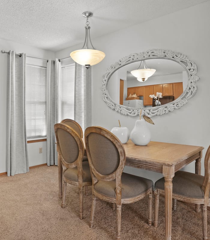 Carpeted dining room at Huntington Park Apartments in Wichita, Kansas