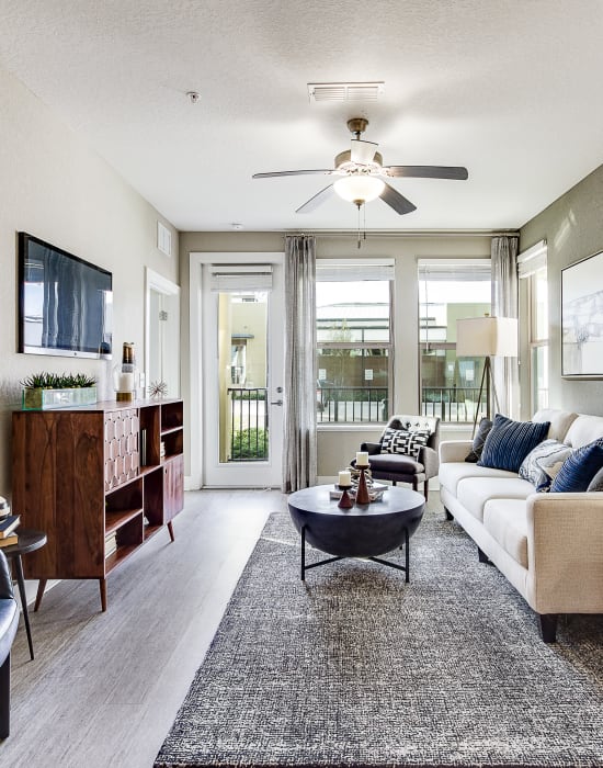 Very spacious living room area with tons of natural light at Steele Creek in Jacksonville, Florida