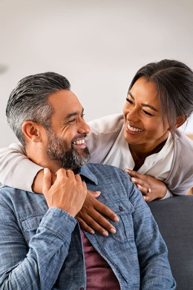 A smiling couple at 55 Brighton at Packard Crossing in Boston, Massachusetts