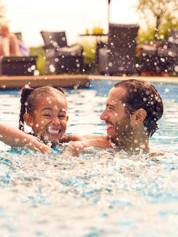 Residents enjoy some pool time at The Retreat at Lake Johnson Apartments, Raleigh, North Carolina