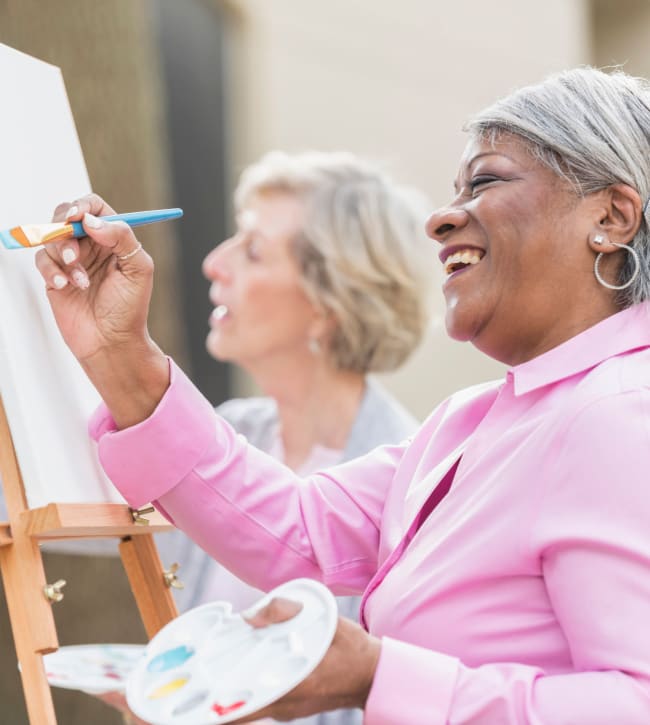 Residents painting together at a community event at Gum Springs Glen in Alexandria, Virginia