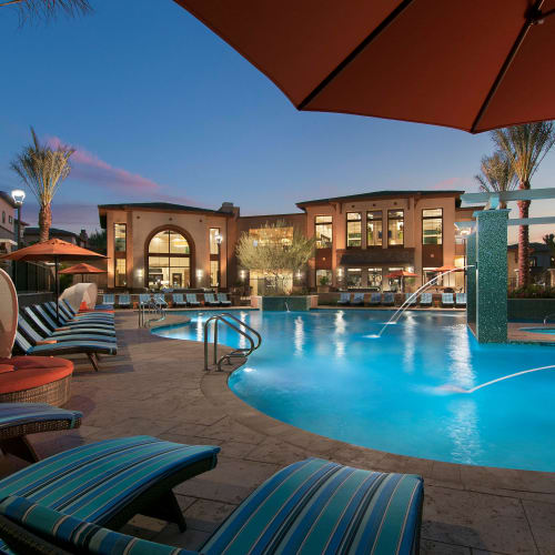 Beautiful resort-style swimming pool at twilight at Redstone at SanTan Village in Gilbert, Arizona