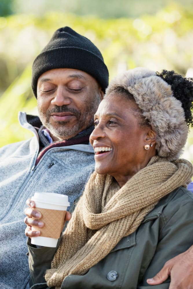 Residents drinking coffee on a bench near Coeur D'Alene Plaza in Spokane, Washington