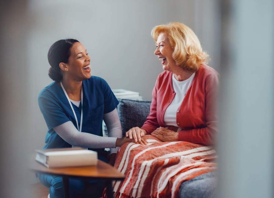  Nurse greeting a resident at The Residences at Thomas Circle in Washington, District of Columbia 