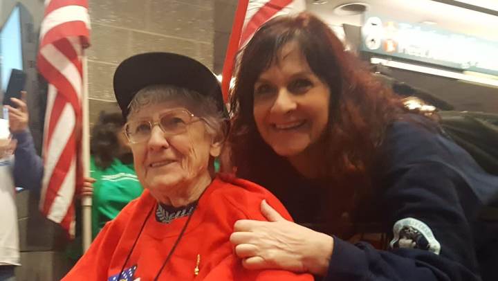 Resident and family member smiling