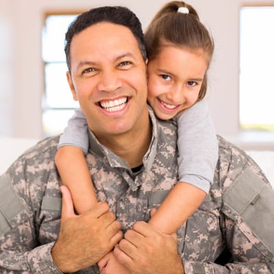 A military father with his daughter at Towne Storage - Clinton in Clinton, Utah