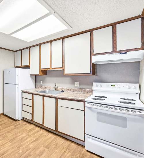 Kitchen with white appliances at Annhurst apartment near Live Greater Baltimore in Belcamp, Maryland