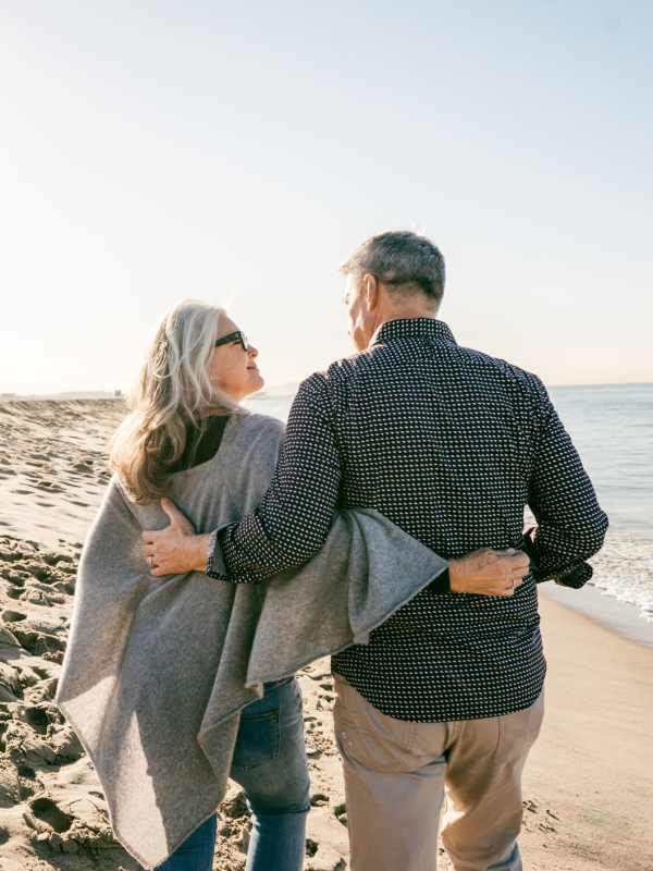 Couple taking a walk on the beach near Visions at Willow Pond in West Palm Beach, Florida