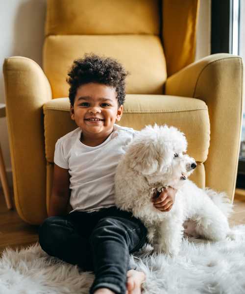 Resident child with his pet dog at Brixin Sonora in Fort Wayne, Indiana