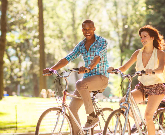 Couple biking in the neighborhood near Alta at Jonquil in Smyrna, Georgia
